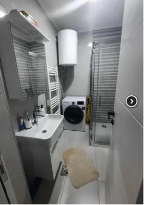 a small bathroom with a sink and a toilet at 7th Sky in Doboj