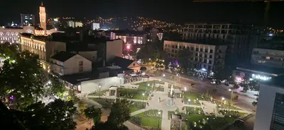 an aerial view of a city at night at APARTMAN POZORISTE Penthaus in Banja Luka