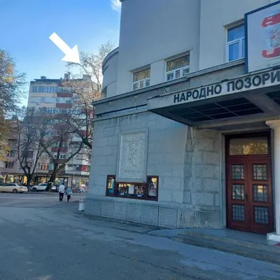 a building with a sign on the front of it at APARTMAN POZORISTE Penthaus in Banja Luka