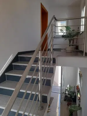 a staircase in a house with blue and white stairs at Apartman Zoran in Livno