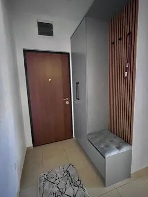 a room with a door and a stool next to a door at APARTMAN MASA in Banja Luka