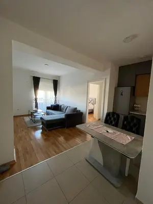 a living room with a couch and a table at APARTMAN MASA in Banja Luka