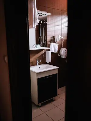 a bathroom with a sink and a mirror at Stara Ada Banja Luka in Banja Luka
