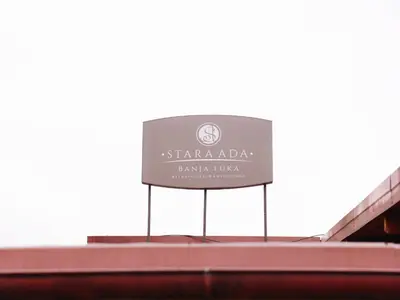 a sign on the top of a building at Stara Ada Banja Luka in Banja Luka