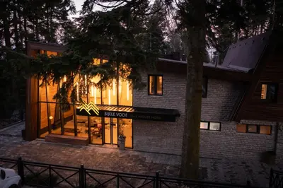 a brick building with a sign that reads the higgins house at Bijele Vode spa&nature hotel in Prijedor