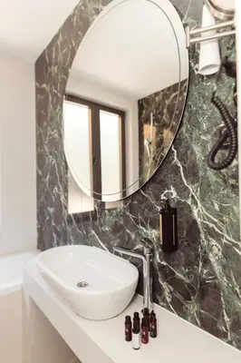 a bathroom with a sink and a mirror at Bijele Vode spa&nature hotel in Prijedor