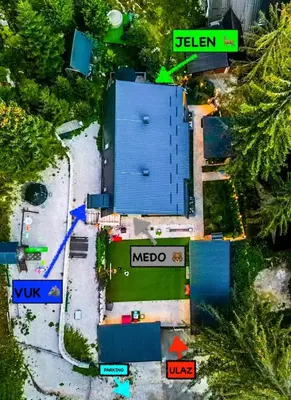 an overhead view of a blue building with street signs at Vila Bašić Vlašić Apartman MEDO in Vlasic