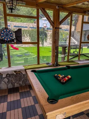 a room with a pool table in a house at Vila Bašić Vlašić Apartman MEDO in Vlasic