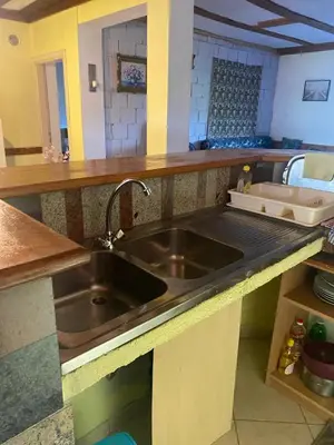 a kitchen with a stainless steel sink in a kitchen at Farma 2 in Cazin