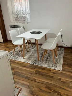 a white table and chairs in a room at Apartman MIA in Travnik