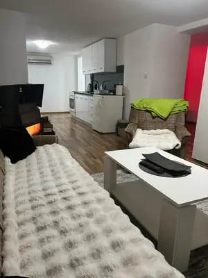 a living room with a couch and a table at Apartman MIA in Travnik