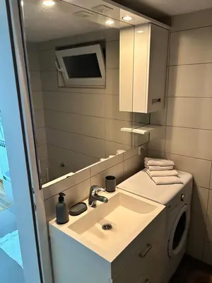 a bathroom with a sink and a mirror at Apartman MIA in Travnik