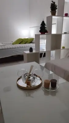 a living room with a plate of food on a table at Apartman Jevrejska Banja Luka in Banja Luka