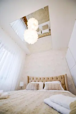 a bedroom with two beds in a attic at Apartman City Charm in Banja Luka