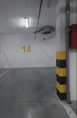 a parking garage with the number on the wall at Apartman Venecija De Lux in Banja Luka