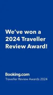 a blue sign that says weve won a traveler review award at Apartman UMA in Bihać