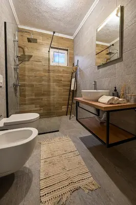 a bathroom with a toilet and a sink at Apartman UMA in Bihać