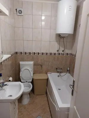 a bathroom with a toilet and a sink at Stan na dan Banja luka in Banja Luka