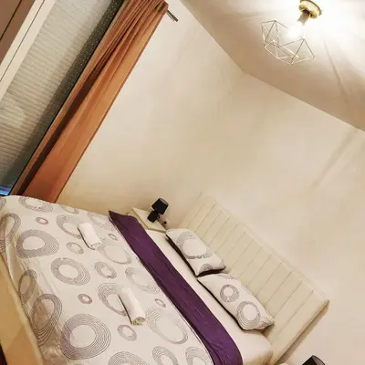 a small bed in a room with at Stan na dan Banja luka in Banja Luka
