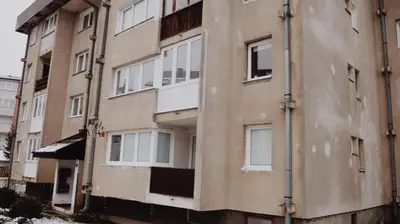 an apartment building with the side of it at Apartman Miškec in Kupres