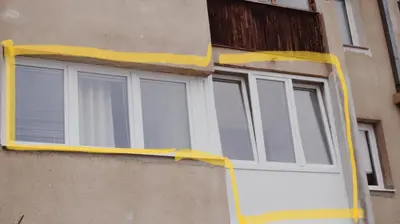a window with a yellow frame on a building at Apartman Miškec in Kupres