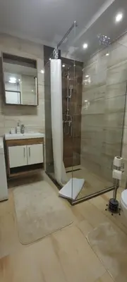 a bathroom with a shower and a sink at Apartman B&D in Tuzla