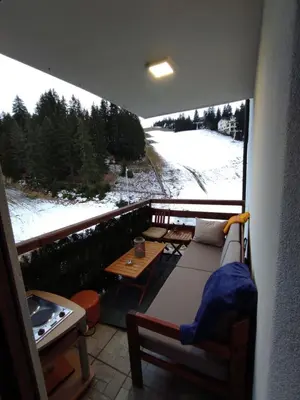 a balcony with a view of a snow covered yard at Apartman Royal Vlašić in Vlasic