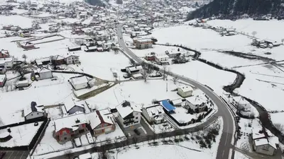 an aerial view of a village in the snow at Prenoćište KRAJINA in Velika Kladuša