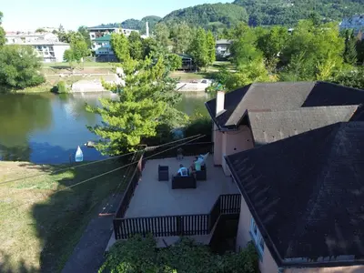 an aerial view of a house with a lake at Riverside Panorama Apartment 1 near City Center Brko 1 in Banja Luka