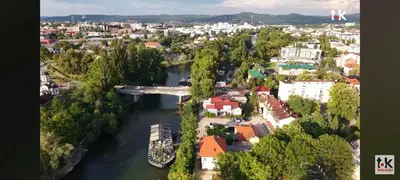 an aerial view of a city with a bridge over a river at Riverside Panorama Apartment 1 near City Center Brko 1 in Banja Luka