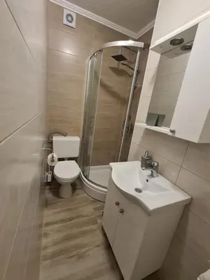 a bathroom with a toilet and a sink and a shower at Čičak in Livno
