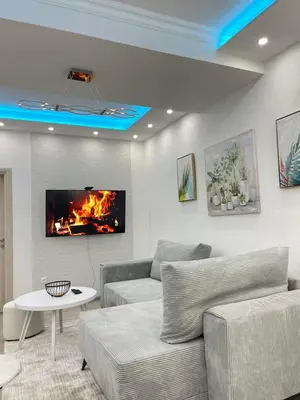 a living room with a couch and a fireplace at Apartmani Porodica Karalić Vlašić in Vlasic
