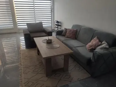 a living room with a couch and a coffee table at NEER in Živinice