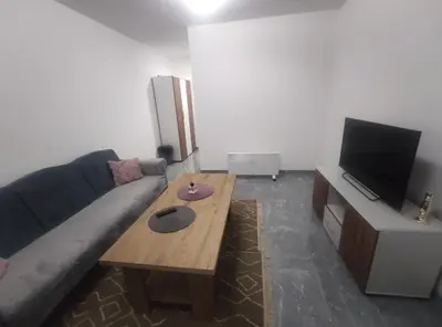 a living room with a couch and a coffee table at NEER in Živinice