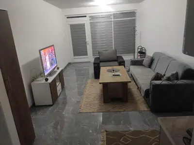 a living room with a couch and a coffee table at NEER in Živinice