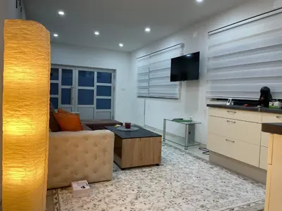 a living room with a couch and a table at Apartman Ćuprija in Cazin