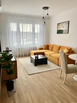 a living room with a couch and a table at Apartment City Park in Banja Luka