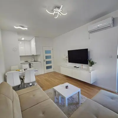 a living room with a couch and a table at Apartman Blok 51 in Banja Luka