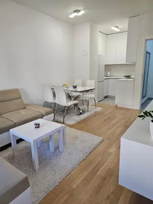 a living room with a couch and a table at Apartman Blok 51 in Banja Luka