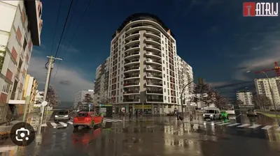 a large building on a rainy city street with cars at Apartman 52 in Doboj