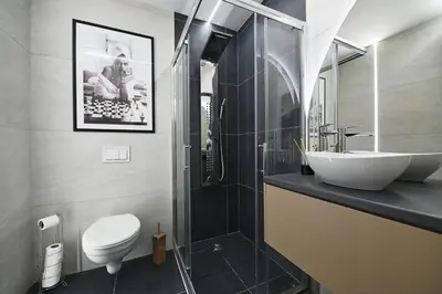 a bathroom with a sink and a toilet at Apartman 52 in Doboj