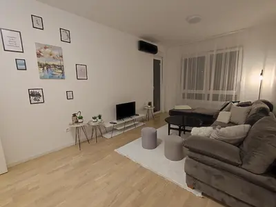 a living room with a couch and a table at Apartman 7 Ladies in Banja Luka