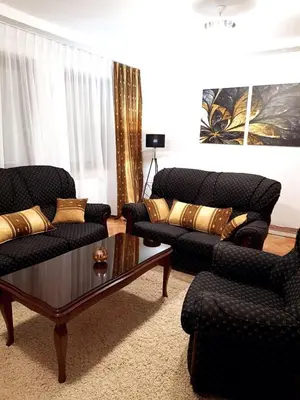 a living room with two couches and a coffee table at Nova DOM in Banja Luka