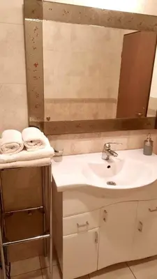 a bathroom with a sink and a mirror at Nova DOM in Banja Luka