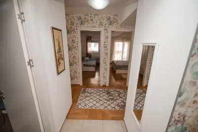 a hallway with a stairway leading to a room at City Museum Apartments Banja Luka in Banja Luka