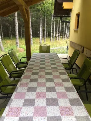 a large table and chairs on a patio at Dream House in Kupres