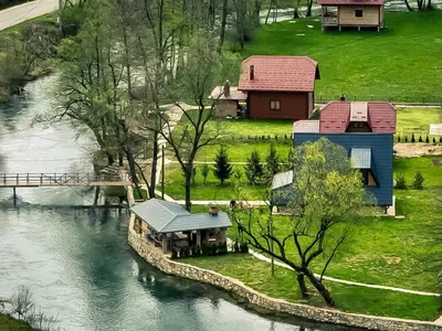 an aerial view of a house next to a river at Vikendica Mia in Šipovo