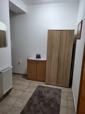 a room with a desk and a cabinet in it at Lavander in Banja Luka