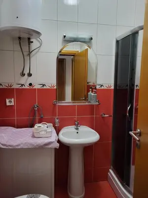 a bathroom with a sink and a mirror at Lavander in Banja Luka