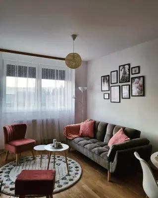 a living room with a couch and a table at Cozy Home Apartment Banja Luka in Banja Luka
